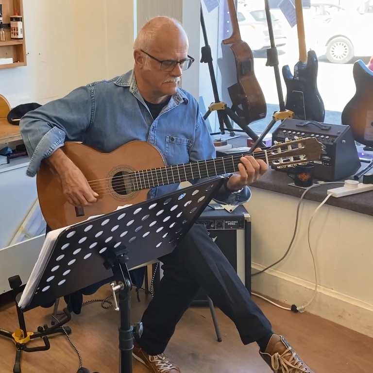 Guitar lesson in progress at Xperience Guitars